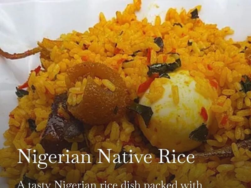 Nigerian native rice topped with smoked fish and egg